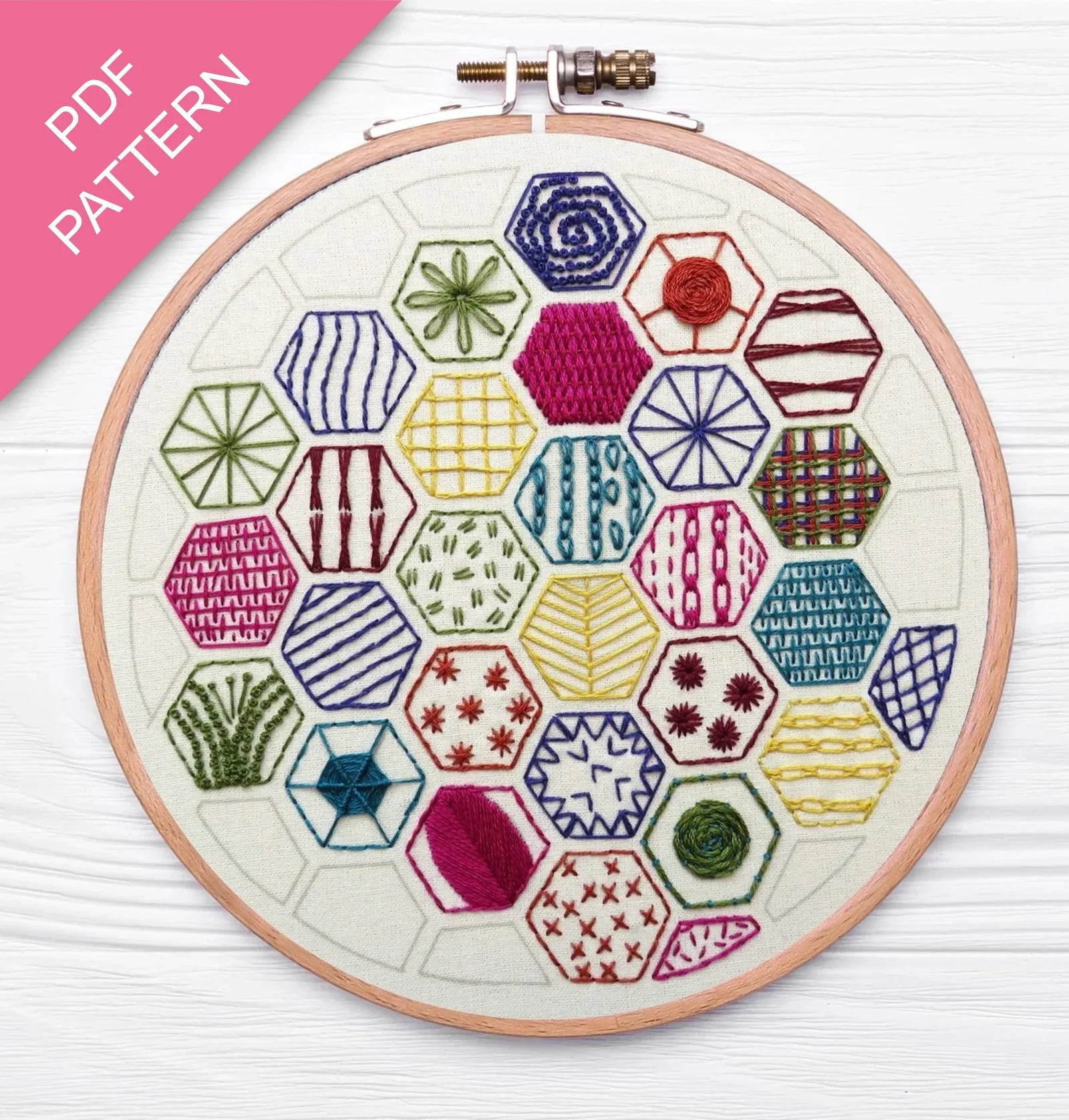 Embroidery hoop with colorful geometric patterns on a white background, labeled 'PDF Pattern'.
