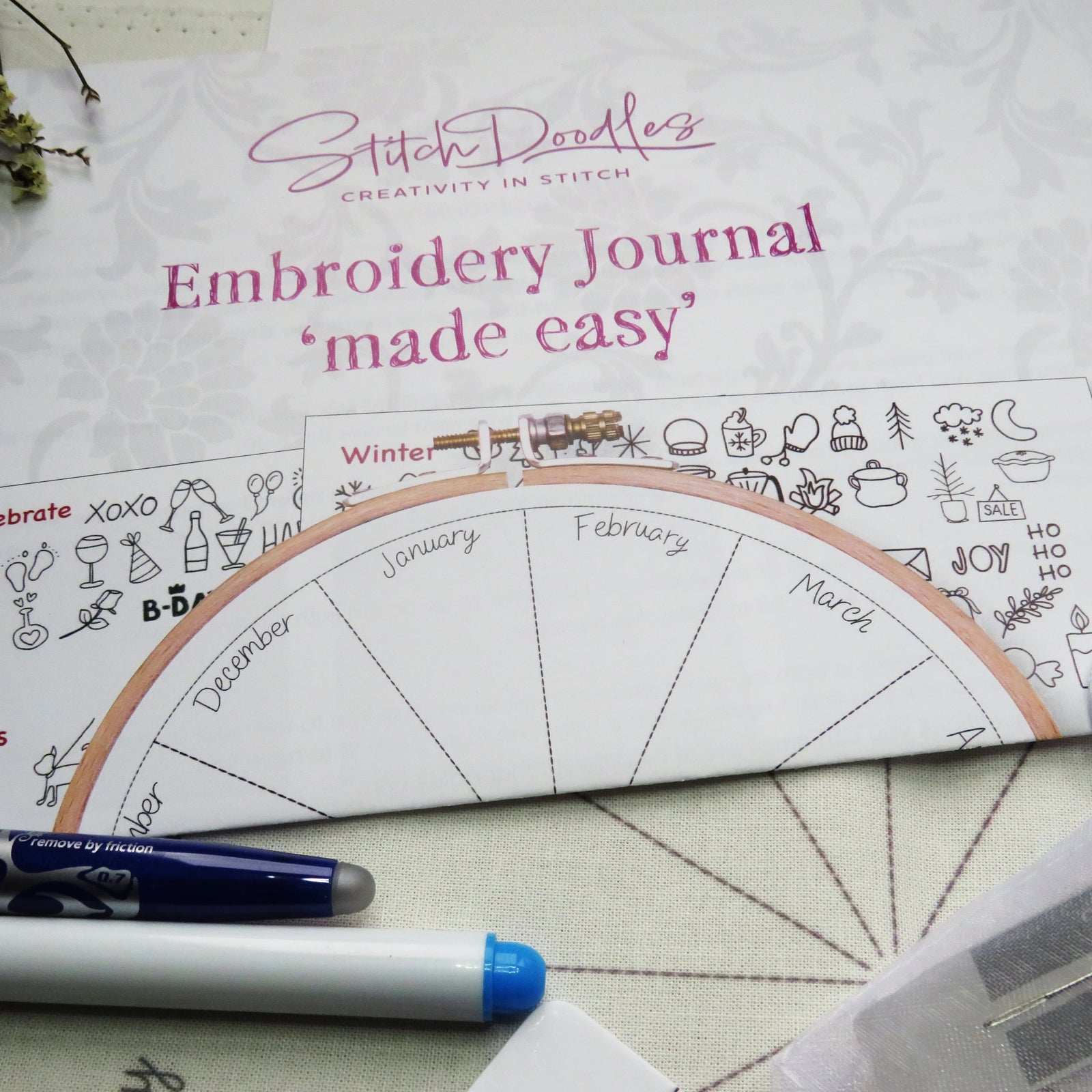 Embroidery journal titled 'made easy' with a hoop and pen on a textured surface