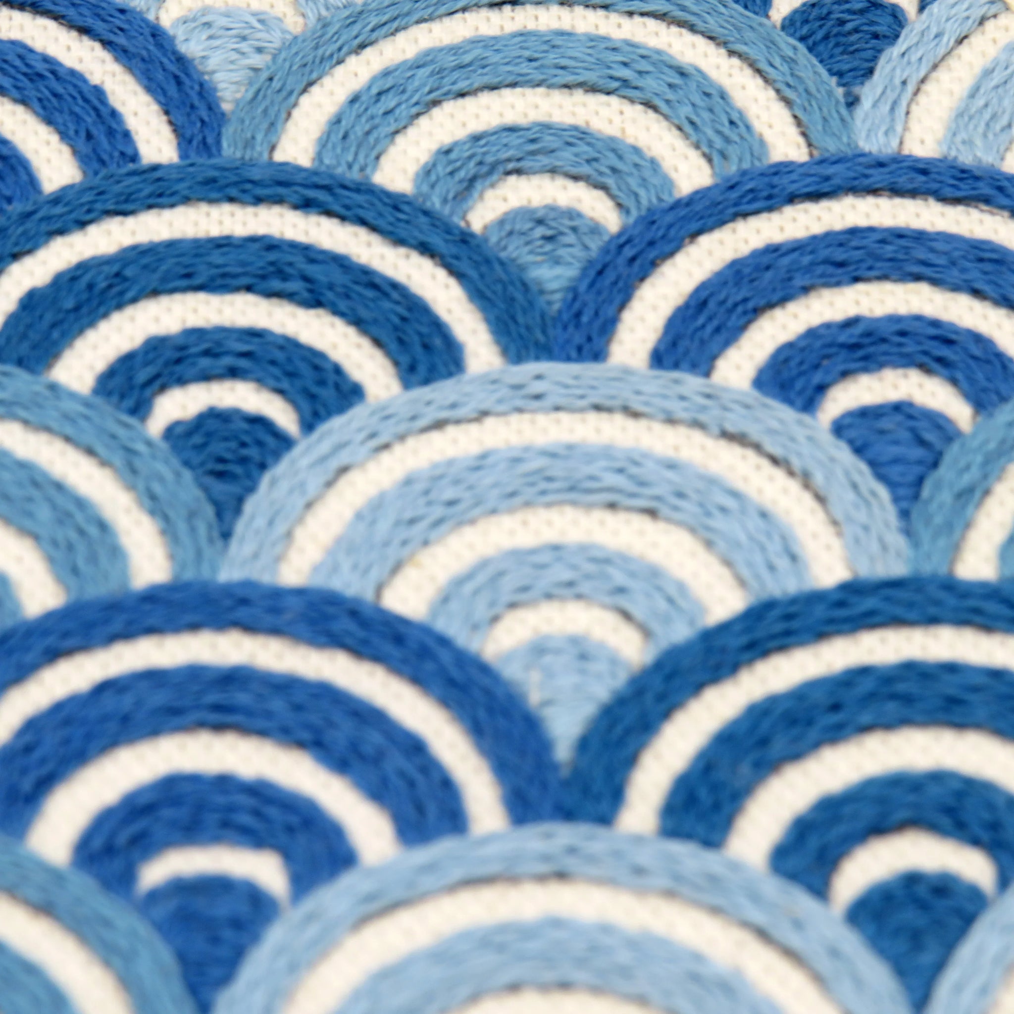 Close-up of a blue and white circular patterned fabric