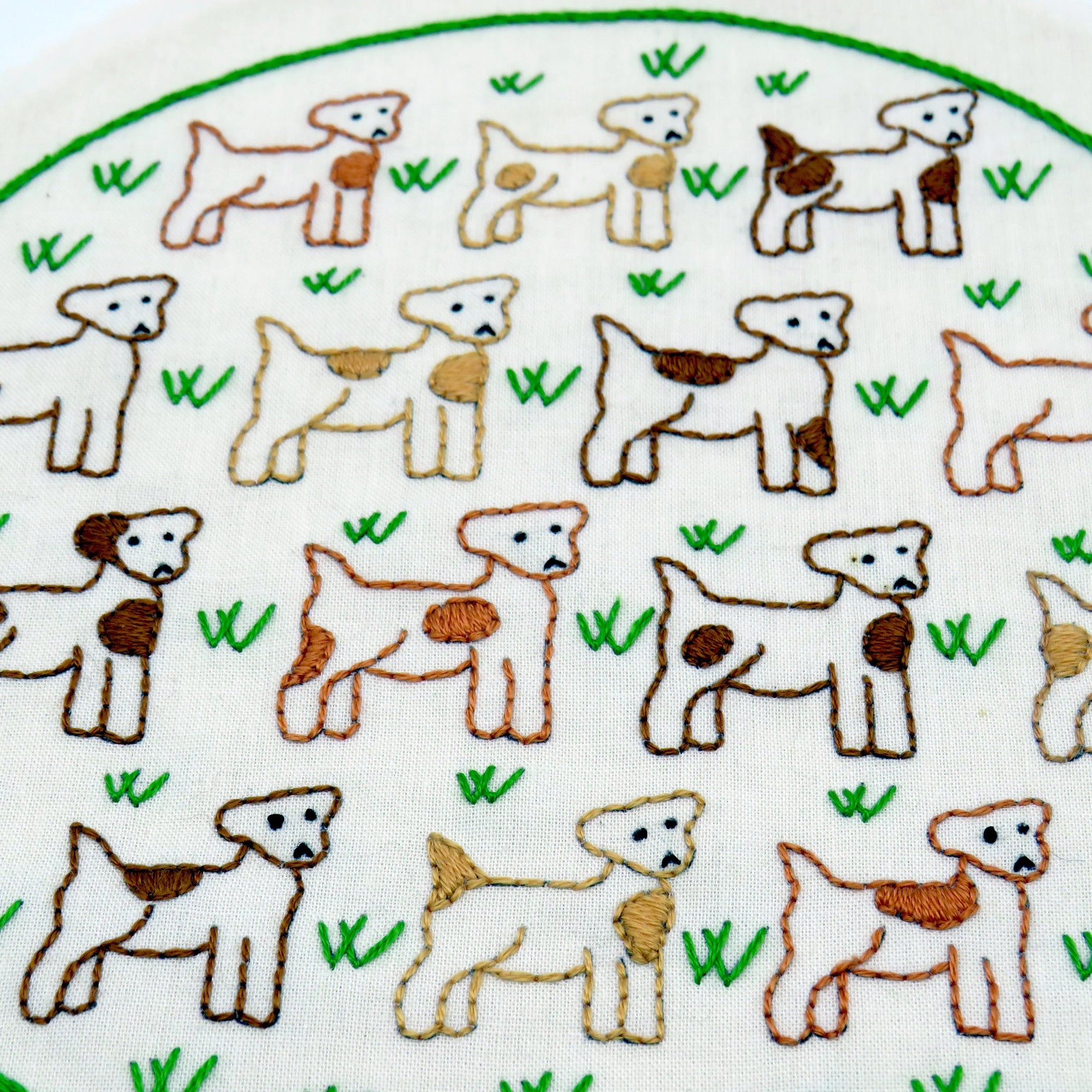 Pattern of dogs and grass on a white background