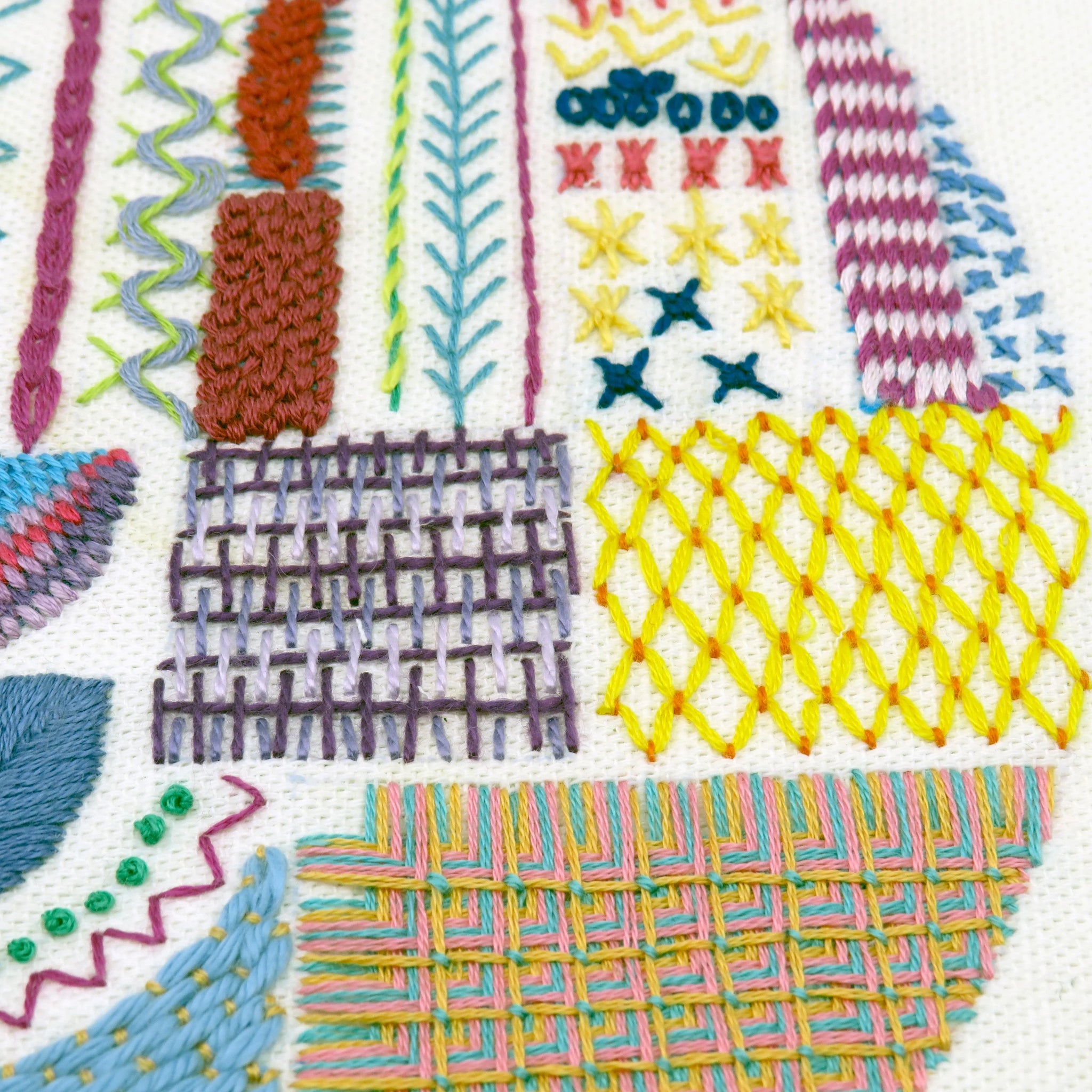 Collection of various embroidery stitches on a white background