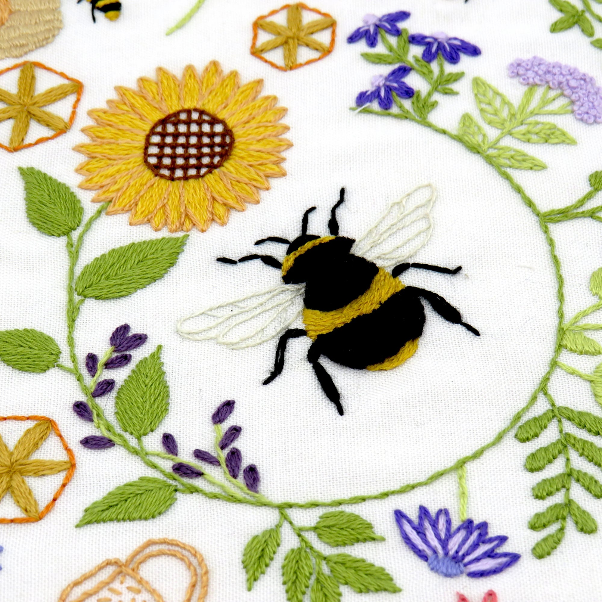 This listing is for a Pre Printed Fabric Panel - the design is printed for you on to a 100% beautiful Ivory Cotton fabric ready for you to get stitching straight away. This will be posted to you.

Bees and Blossoms is designed to be a calm and relaxing pattern to stitch with beautiful flowers and bees all surrounding the fabulous central bee that is wrapped inside a pretty sunflower.