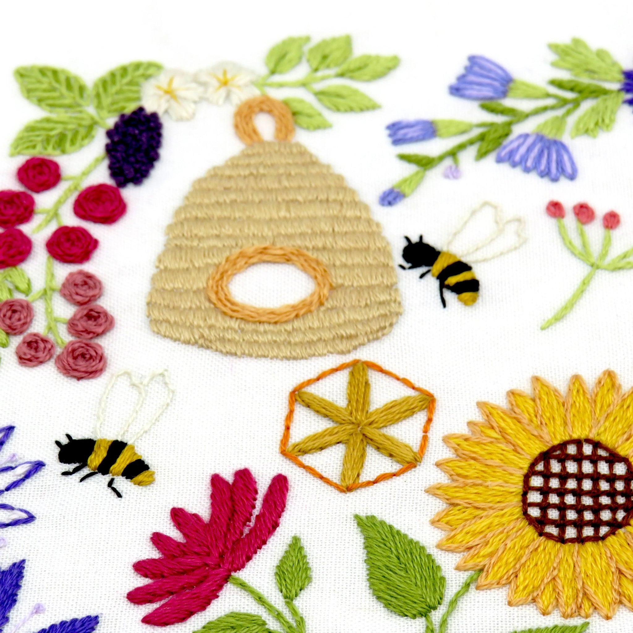 This listing is for a Pre Printed Fabric Panel - the design is printed for you on to a 100% beautiful Ivory Cotton fabric ready for you to get stitching straight away. This will be posted to you.

Bees and Blossoms is designed to be a calm and relaxing pattern to stitch with beautiful flowers and bees all surrounding the fabulous central bee that is wrapped inside a pretty sunflower.