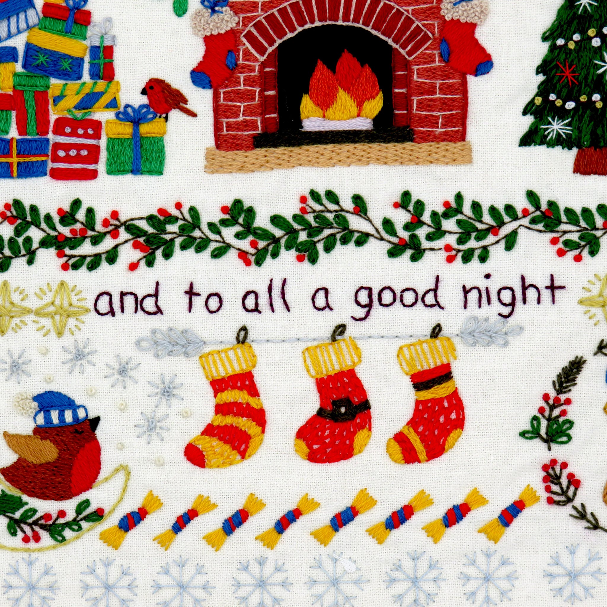 Christmas-themed fabric with stockings, fireplace, and 'and to all a good night' text.