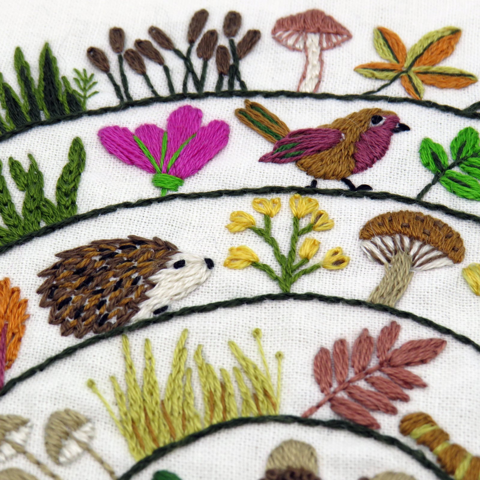 Stitch a delightful woodland with birds, woodland creatures, grasses, flowers, mushrooms, berries and leaves! All in a wonderful and whimsical spiral design.