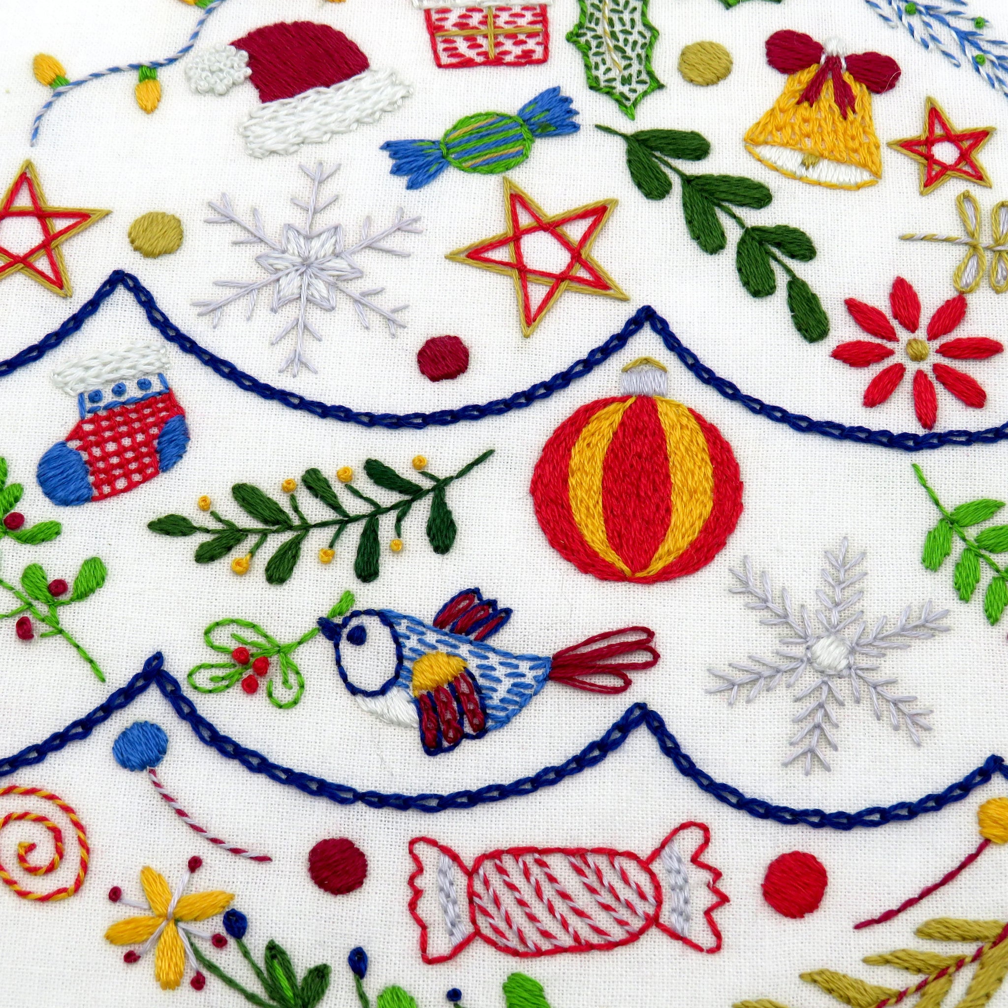 Delight in creating your own beautiful Christmas embroidery pattern in December. Stitch one festive element every day of Advent and experience the joy of counting down to Christmas. Let your creativity shine as you work with fabric, colorful threads, and a variety of lovely stitches!