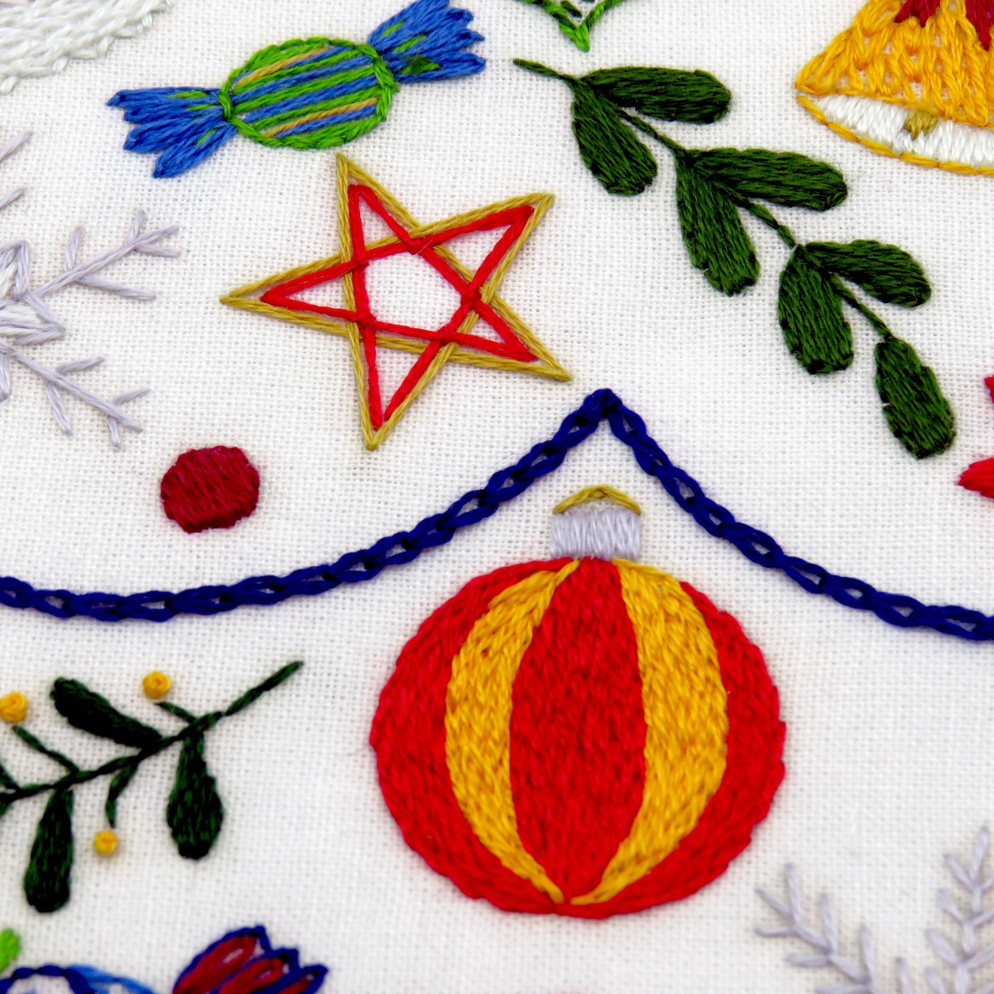 Delight in creating your own beautiful Christmas embroidery pattern in December. Stitch one festive element every day of Advent and experience the joy of counting down to Christmas. Let your creativity shine as you work with fabric, colorful threads, and a variety of lovely stitches!