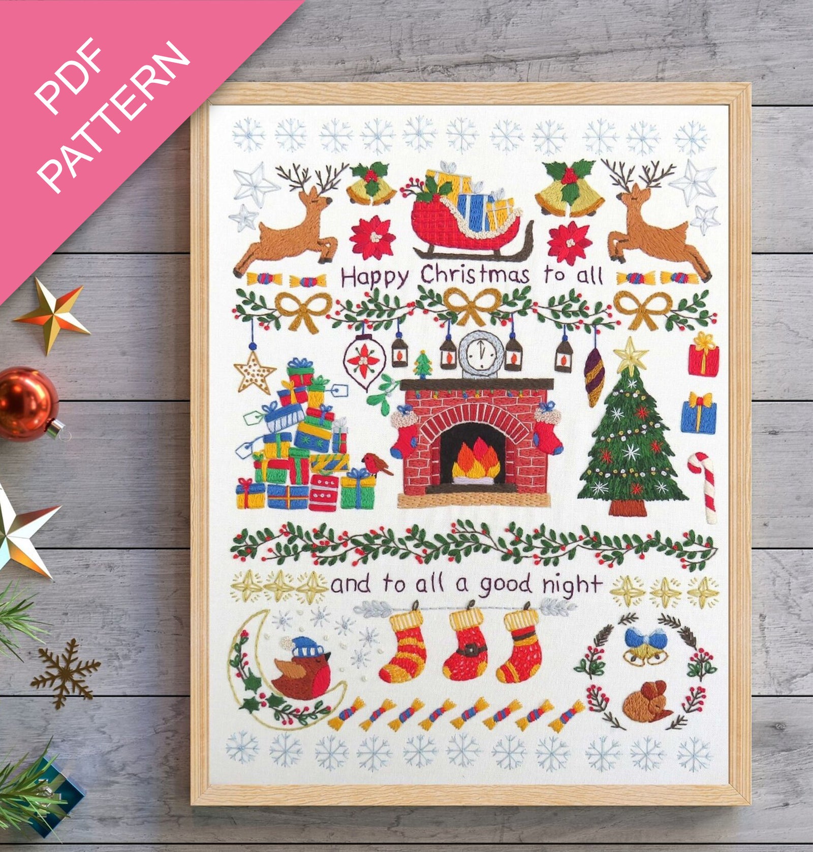 Framed Christmas-themed PDF pattern with festive elements on a wooden surface.