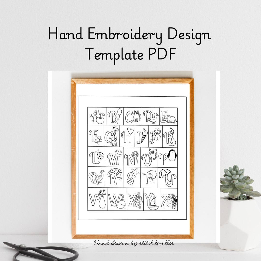 Hand embroidery design template PDF with alphabet and symbols in a wooden frame on a white background.