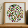 Framed artwork with a colorful circular design of animals and plants on a wooden shelf.