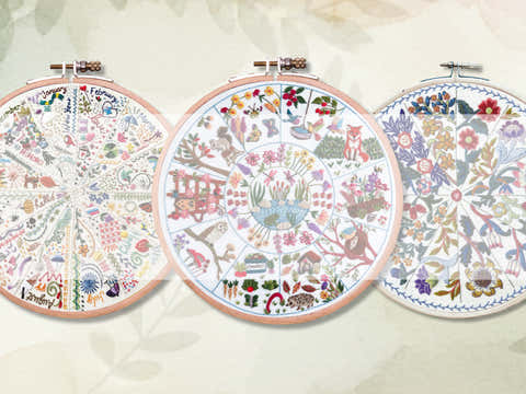 Stitchdoodles modern hand embroidery. Three embroidery hoops with colorful floral patterns on a light background