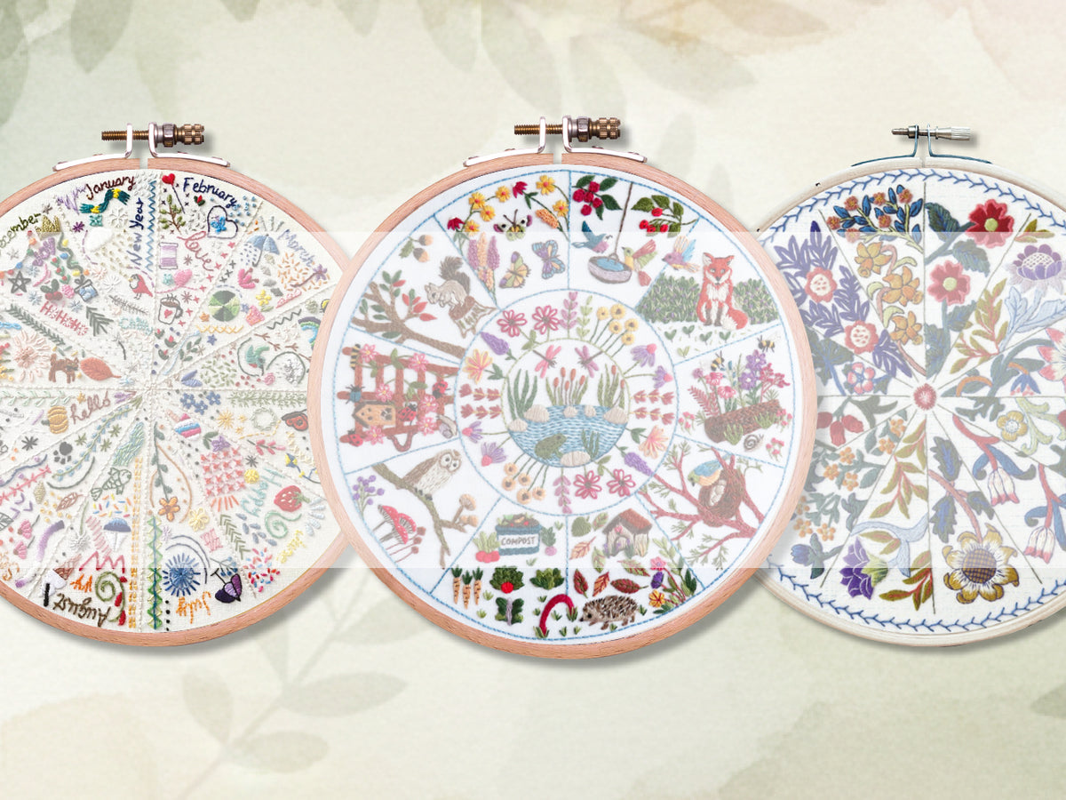 Stitchdoodles modern hand embroidery. Three embroidery hoops with colorful floral patterns on a light background