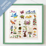 Framed fabric pattern with embroidered designs of animals, plants, and nature-themed elements.