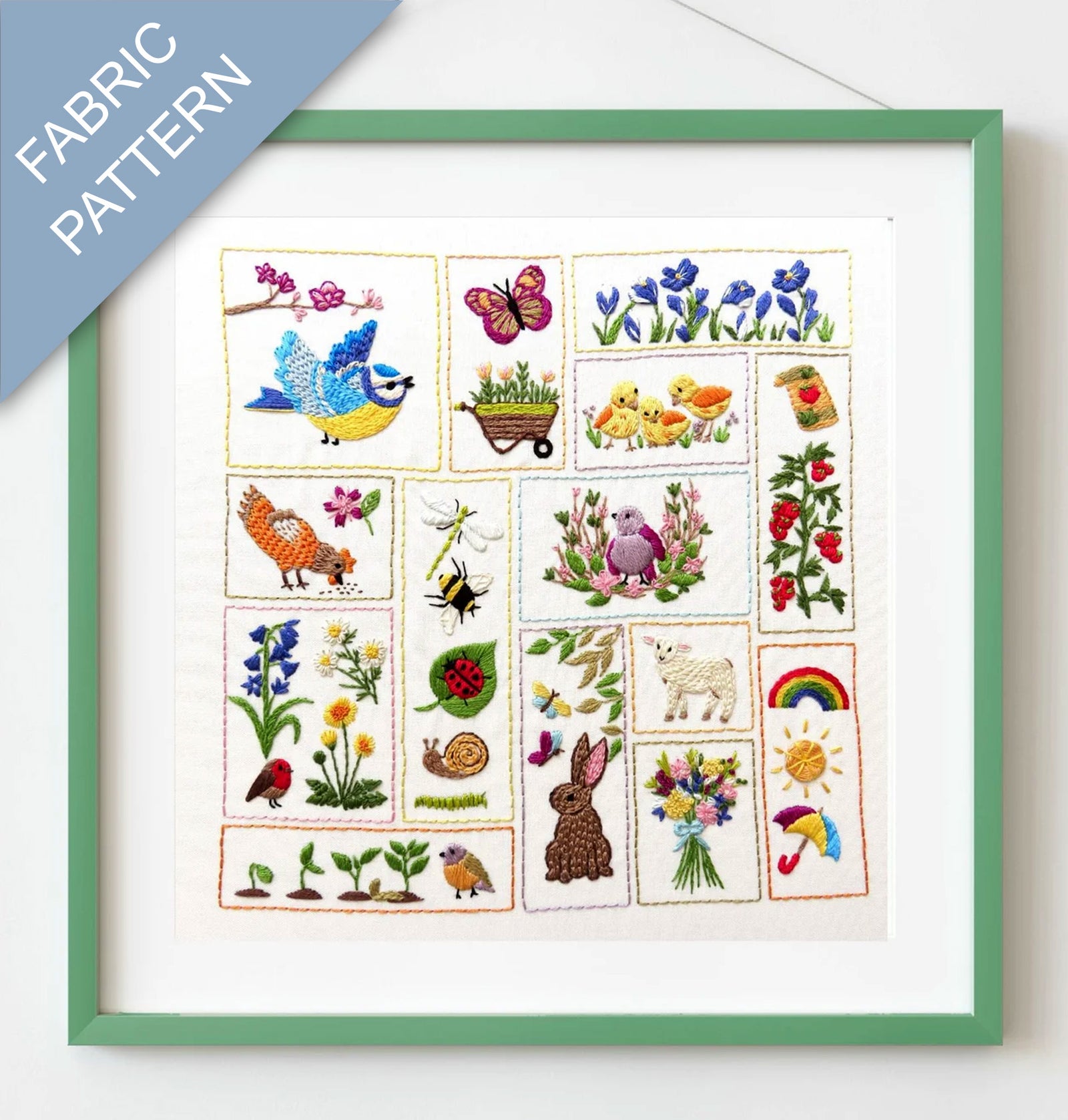 Framed fabric pattern with embroidered designs of animals, plants, and nature-themed elements.