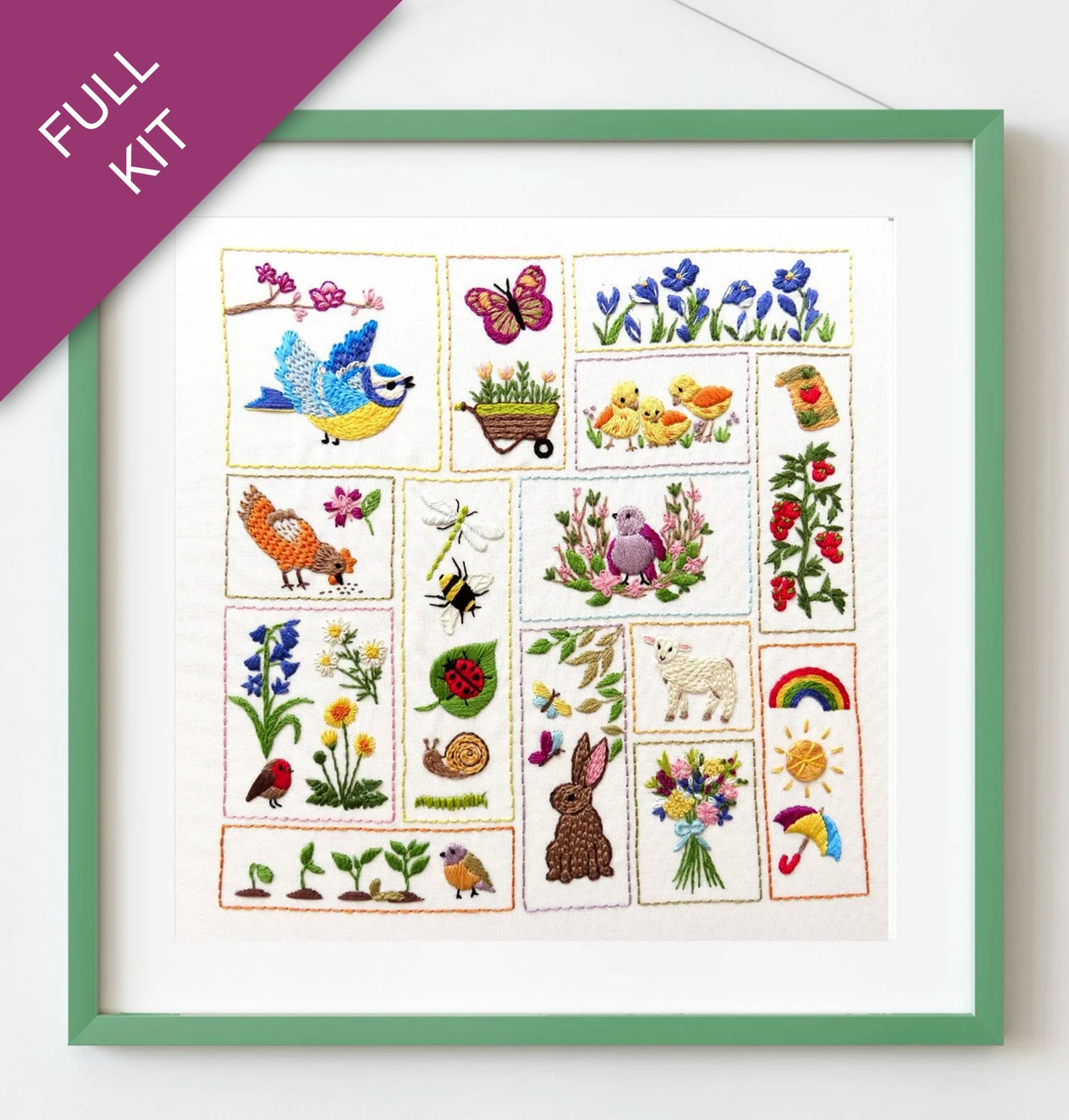 Framed set of embroidered stickers with various designs including animals, plants, and nature-themed elements.