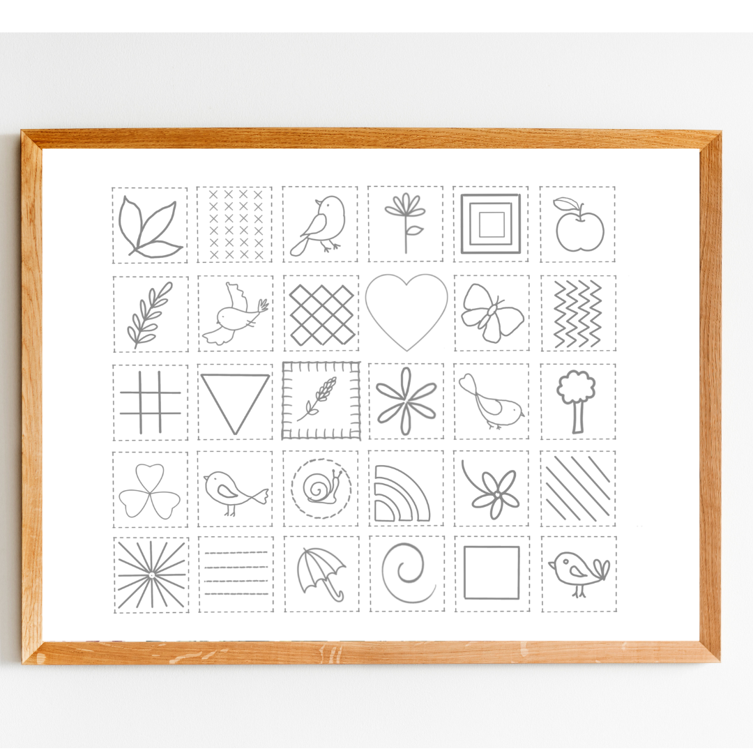 Framed print with black line art designs on a white background