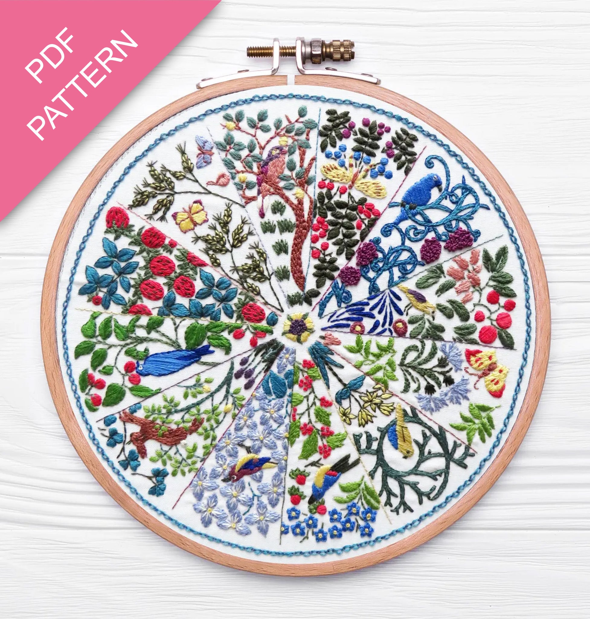 Embroidery hoop with a colorful floral and bird design on a white background, labeled 'PDF Pattern'.