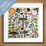 Fabric pattern with animals, trees, and plants on a wooden surface