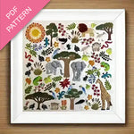 Framed PDF pattern with colorful animal and nature illustrations on a wooden surface.