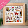 Framed embroidery pattern with nature-themed designs on a wooden surface.