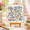 The colorful flora and fauna provide the perfect place for all the lovely birds to escape into as they enjoy the plentiful supply of strawberries, blackberries and blueberries.

This is a colorful hand embroidery sampler with an array of simple stitches making up all the different elements. See how many ladybirds, beetles and bees you can find as you stitch your way through the beautiful design.