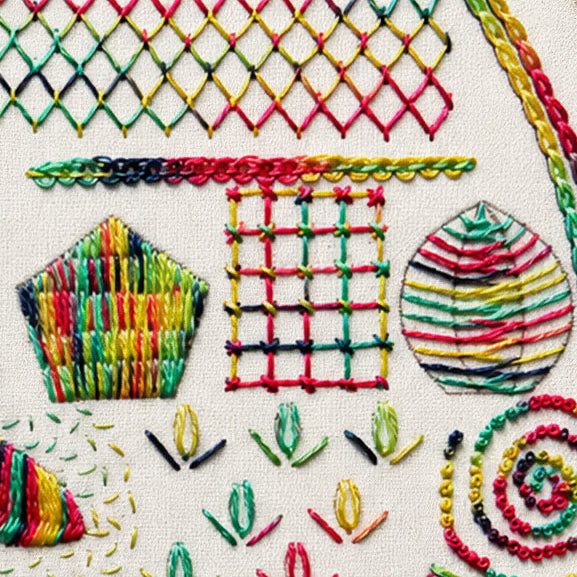 Close-up of multicolored embroidery stitched onto a cream fabric background, featuring geometric and floral motifs including a diamond lattice, a pentagon, a grid, a striped oval, and leaf shapes.