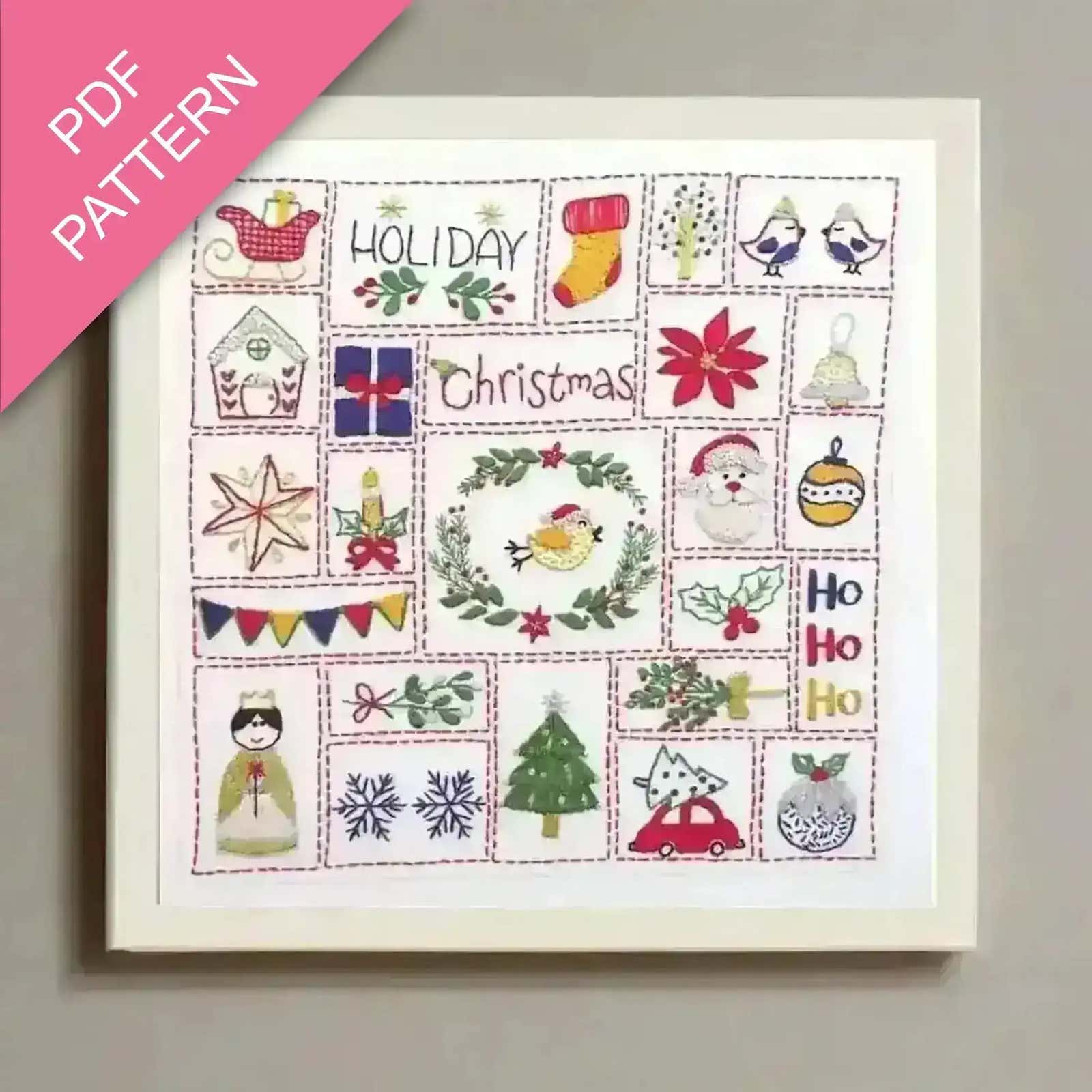 Framed cross-stitch pattern with Christmas-themed designs on a light gray background.