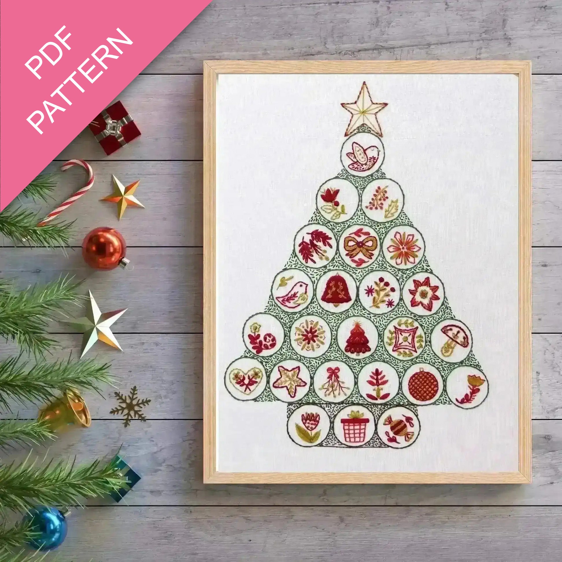 Framed Christmas tree pattern with decorative elements on a wooden surface
