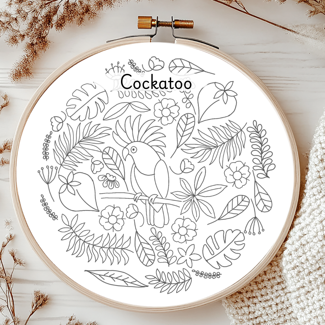Embroidery hoop with a Cockatoo design on a white background