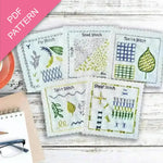 Embroidery pattern with various stitches on a wooden surface, featuring a PDF pattern label.