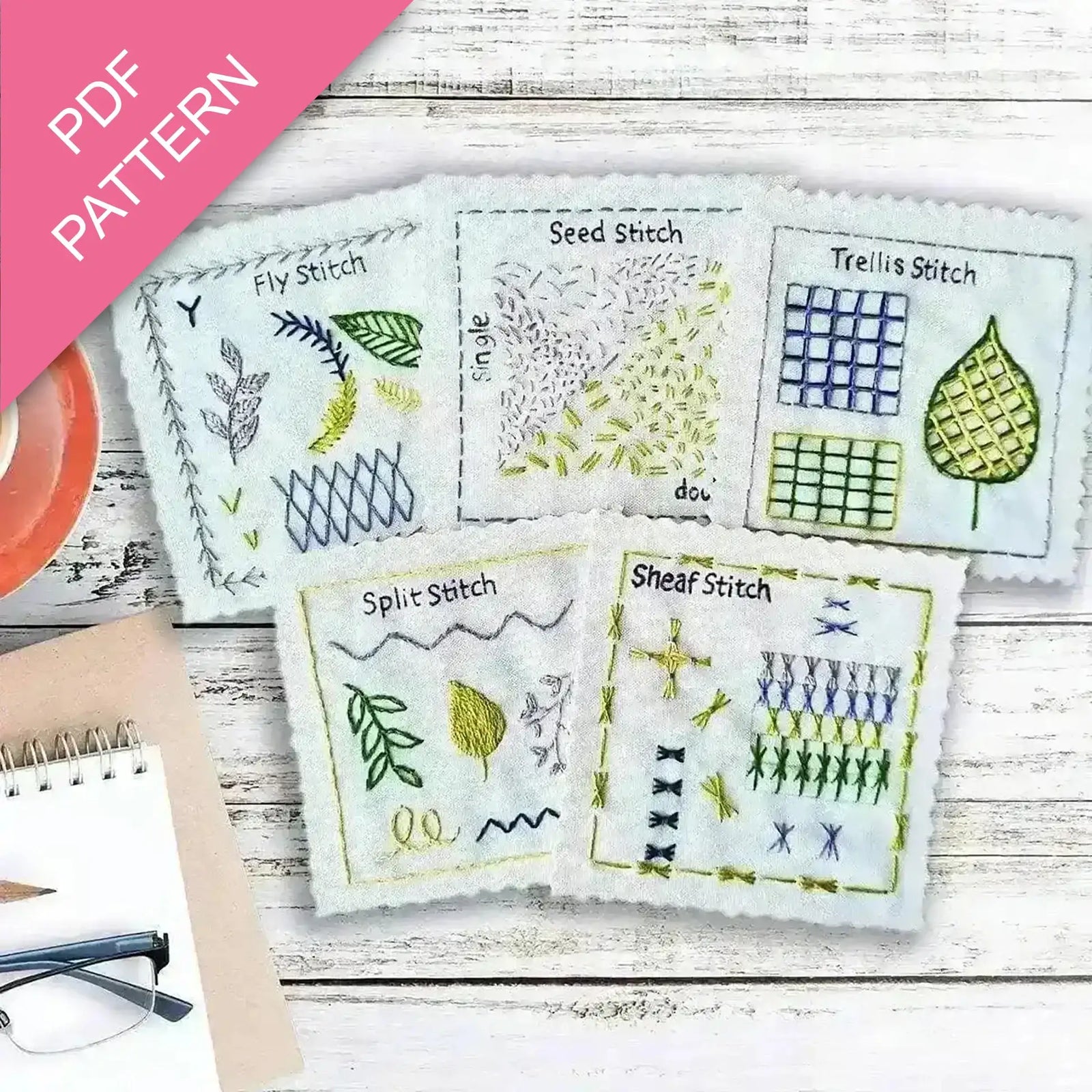 Embroidery pattern with various stitches on a wooden surface, featuring a PDF pattern label.