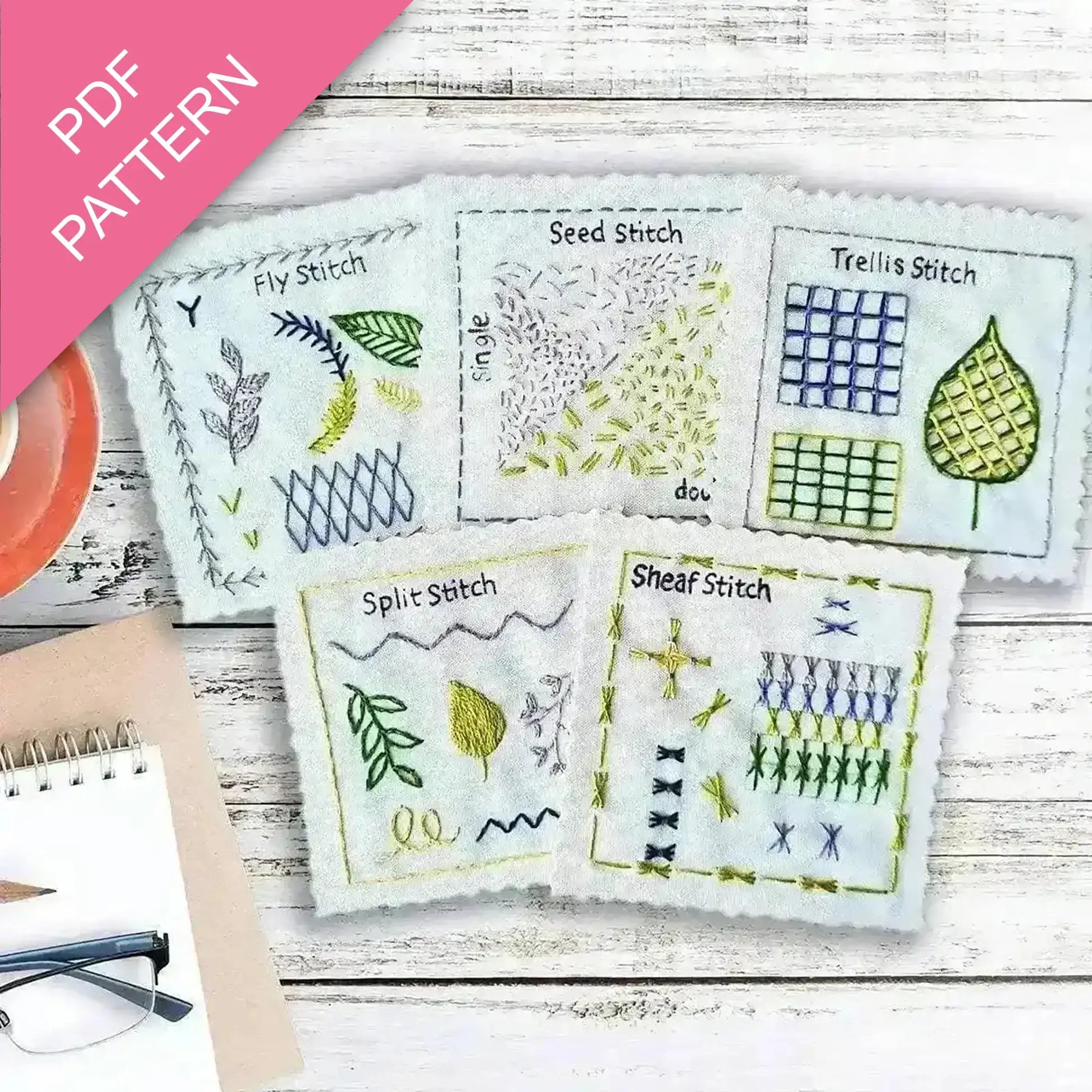 Embroidery pattern with various stitches on a wooden surface, featuring a PDF pattern label.
