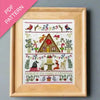 Framed cross-stitch pattern with Christmas-themed design on a gray background