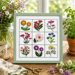 Framed embroidery of various flowers on a white background hand embroidery kit pattern