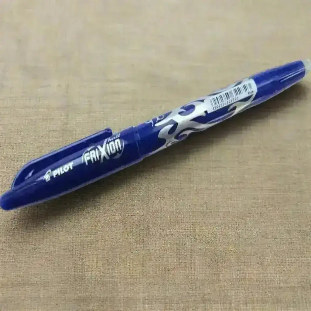 Pilot Frixion pen on a beige fabric background