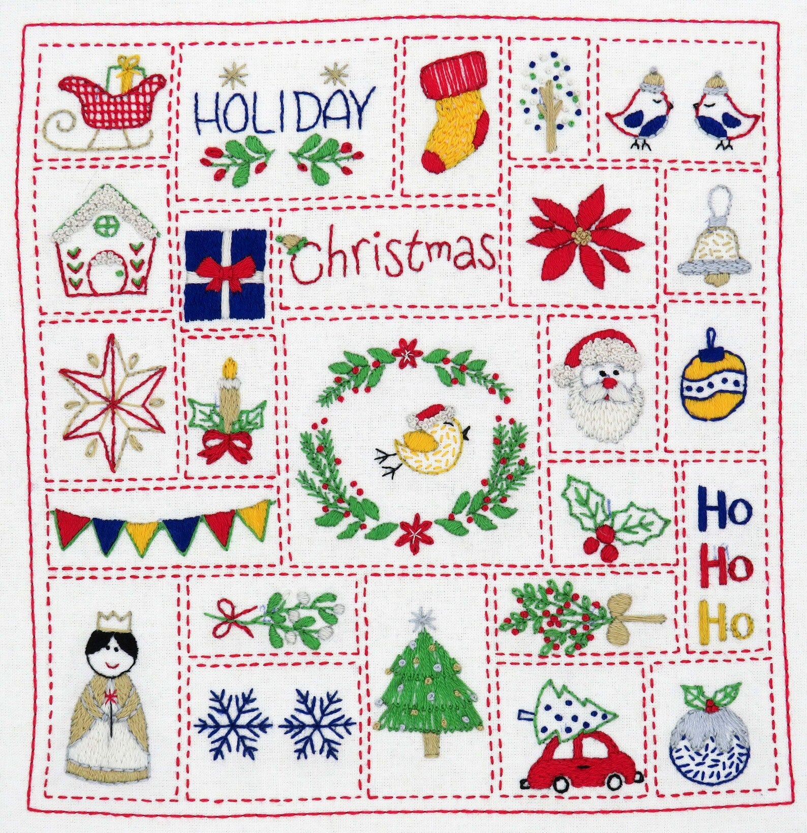 Embroidered Christmas-themed fabric with various festive designs on a white background.