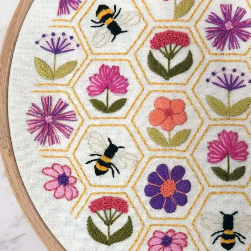 Embroidery hoop with floral and bee pattern