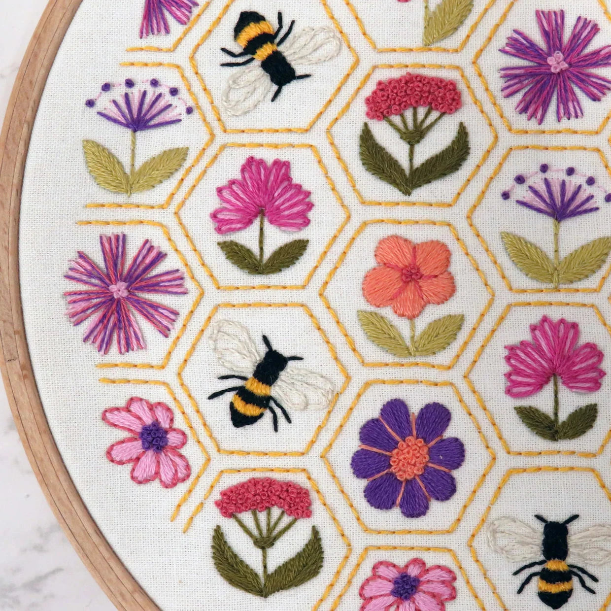 Embroidery hoop with floral and bee pattern