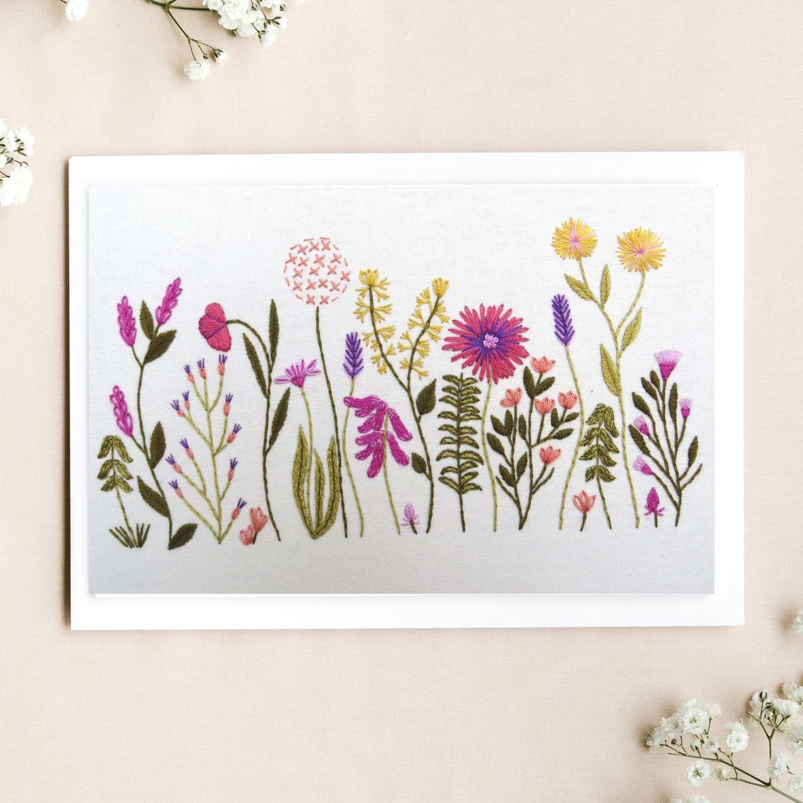 Art print of colorful floral design on a beige background