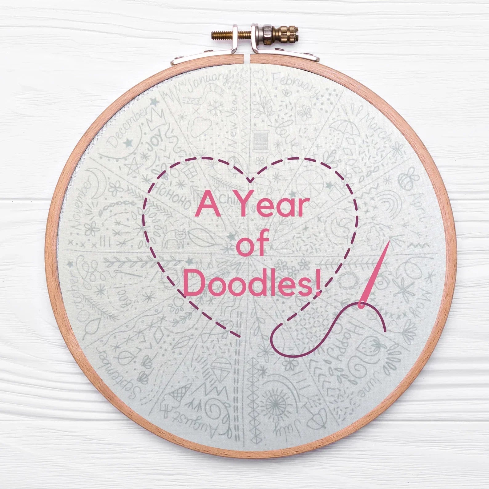 Embroidery hoop with 'A Year of Doodles!' text on a white background