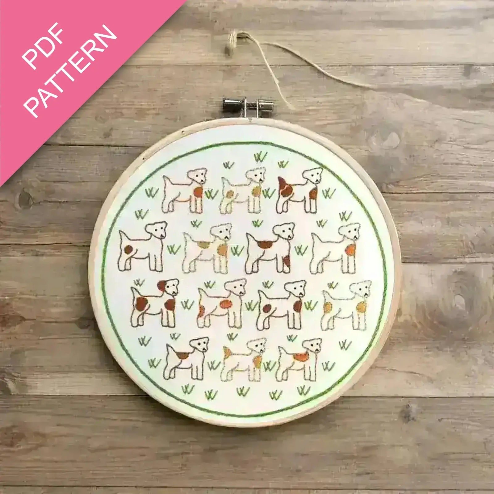 Embroidery hoop with dog pattern on a wooden surface, labeled 'PDF Pattern'.