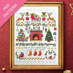 Framed Christmas-themed cross-stitch pattern with decorative elements on a red background.