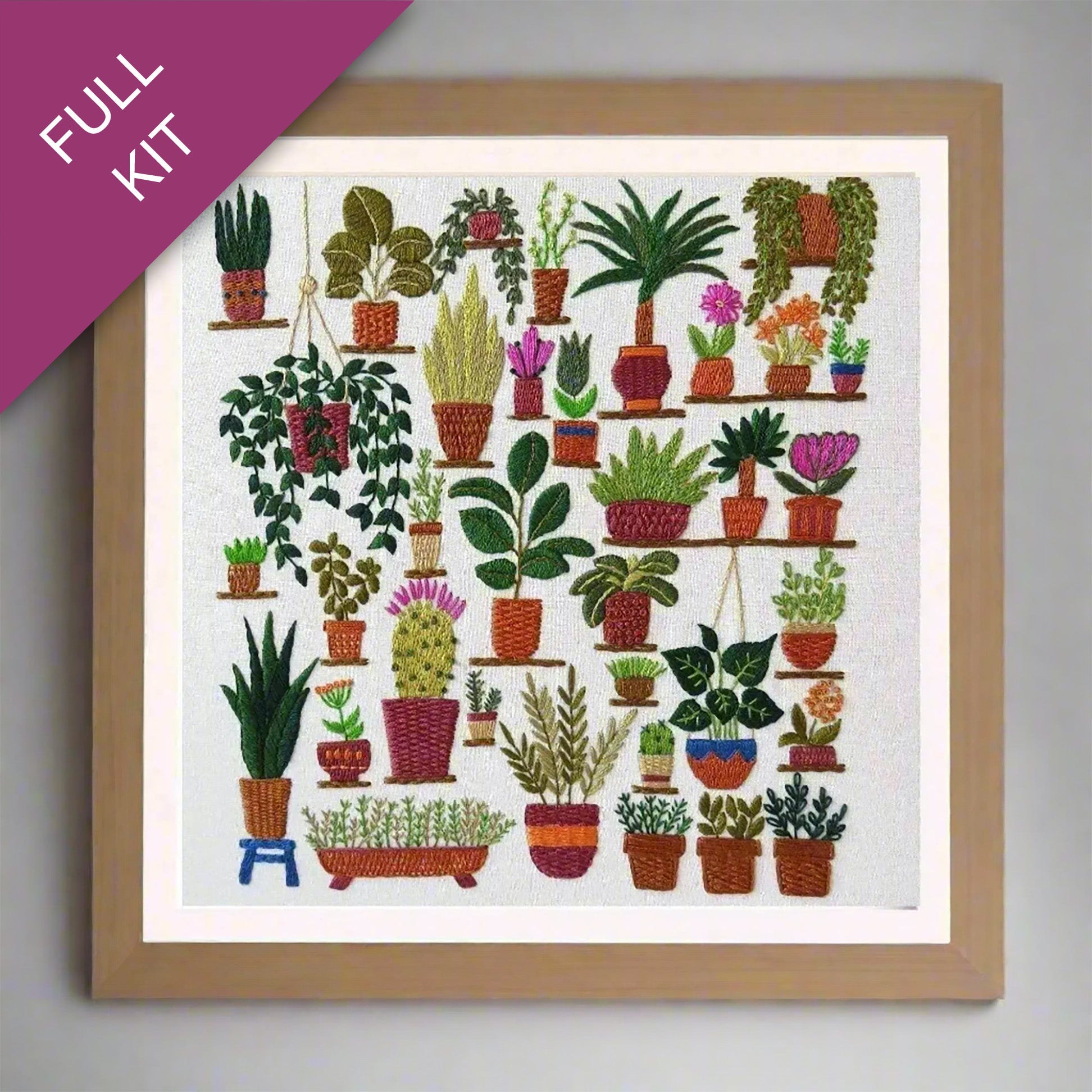 Embroidery kit with a design of potted plants on a white background