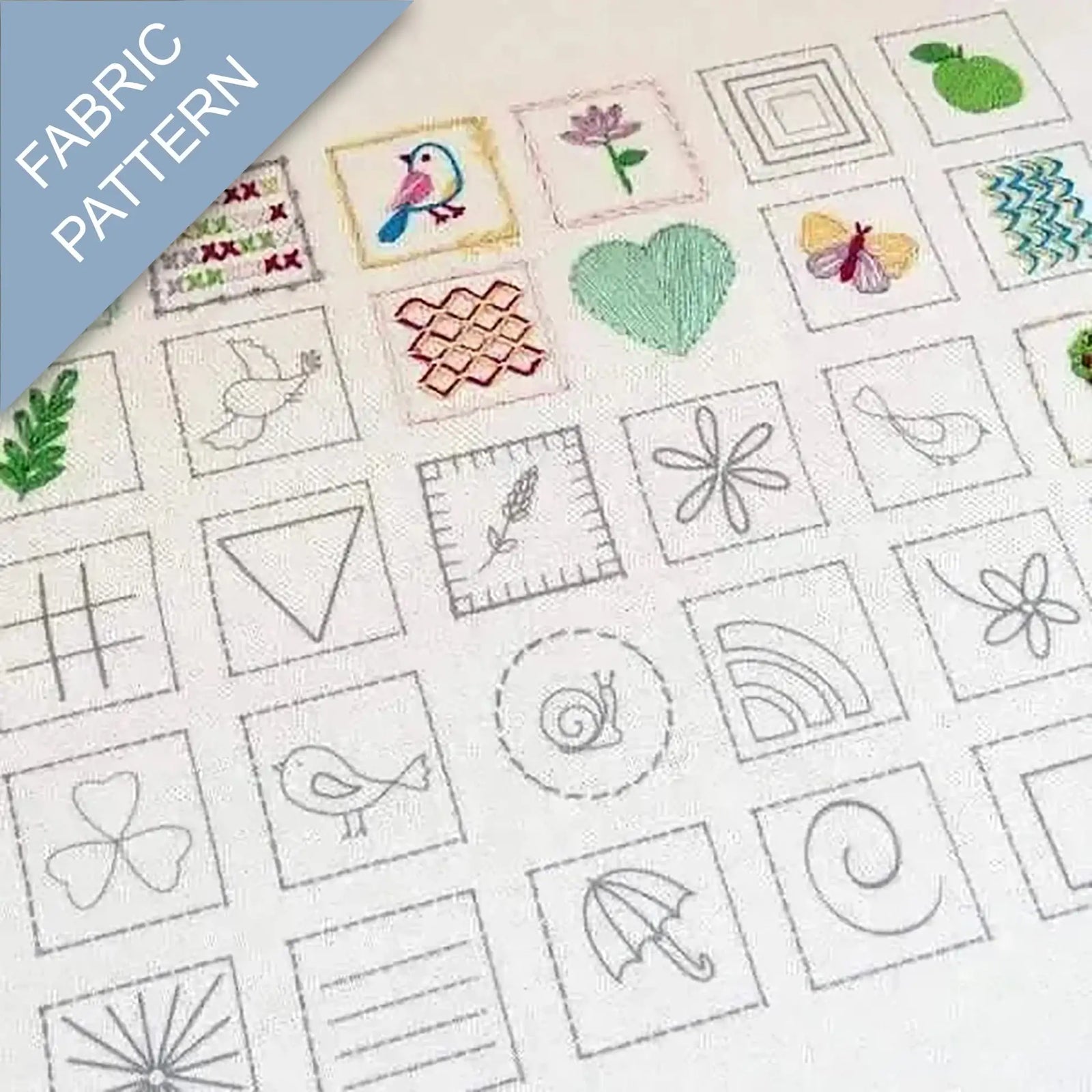 Collection of embroidered patterns on fabric with various designs including birds, flowers, and geometric shapes.