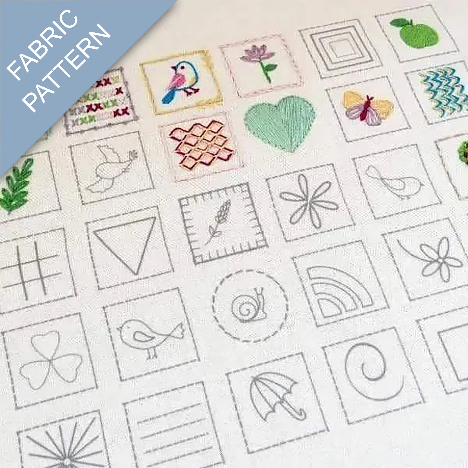 Collection of embroidered patterns on fabric with various designs including birds, flowers, and geometric shapes.