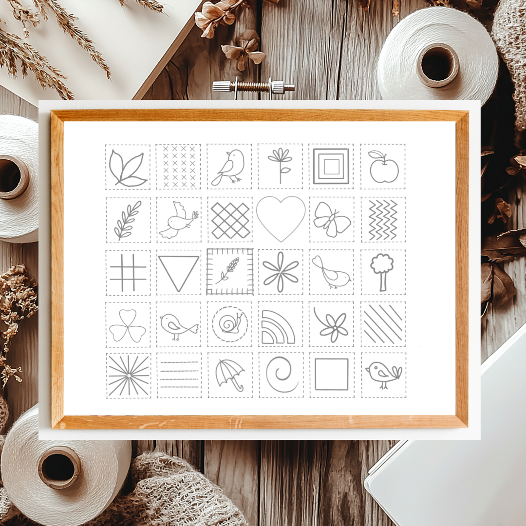 Framed set of black line art illustrations on a wooden surface with natural elements.