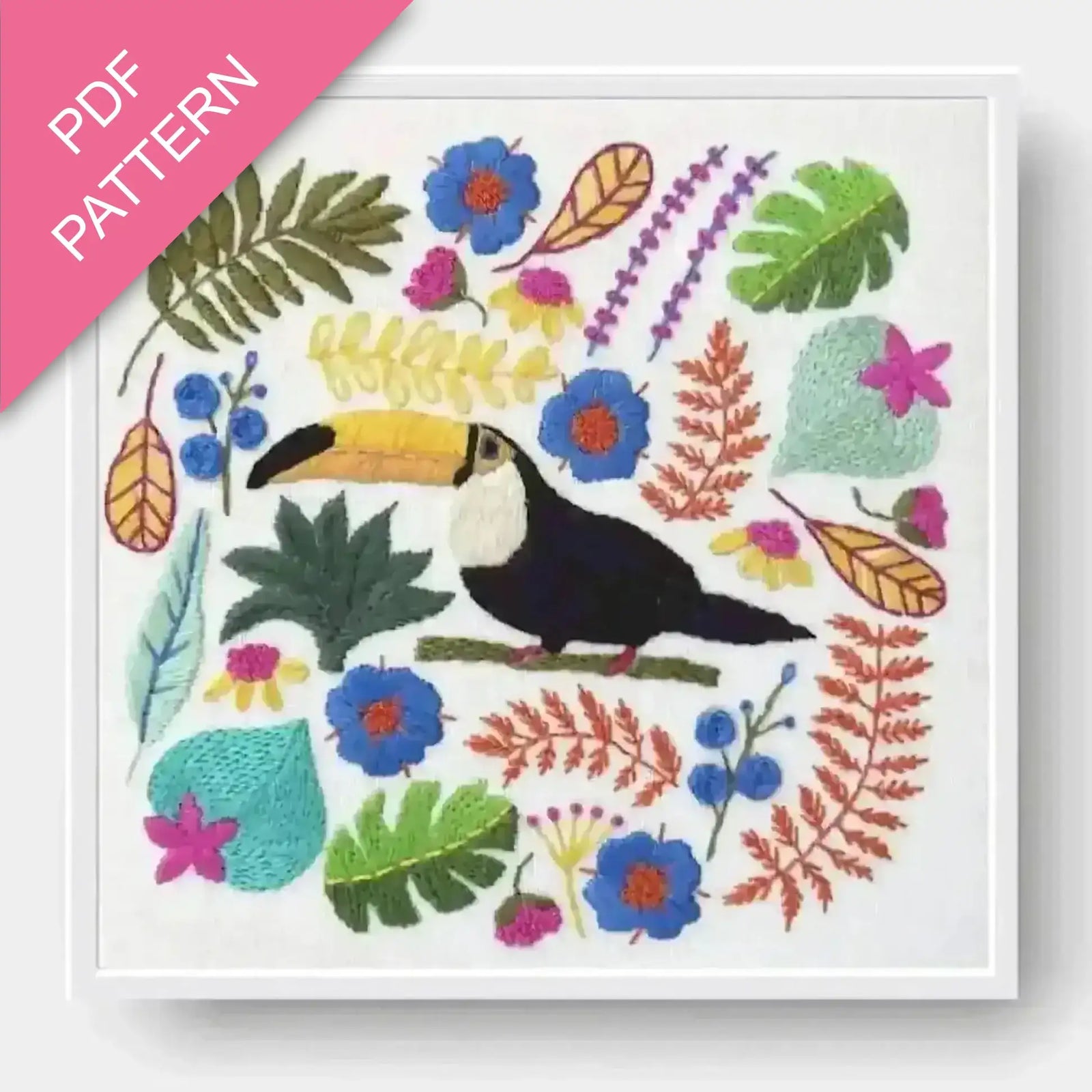Colorful embroidery pattern with a toucan and tropical leaves on a white background