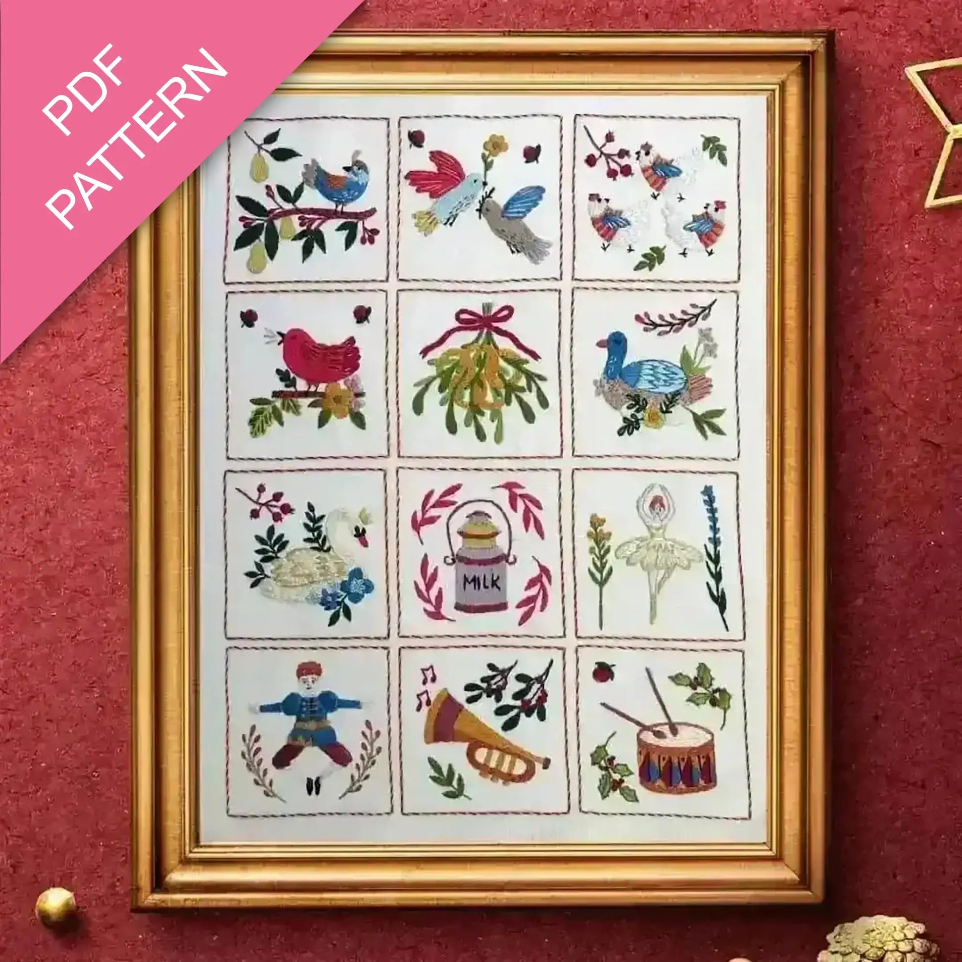 Framed cross-stitch pattern with various designs on a red background