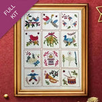 Framed cross-stitch kit with various designs on a red background