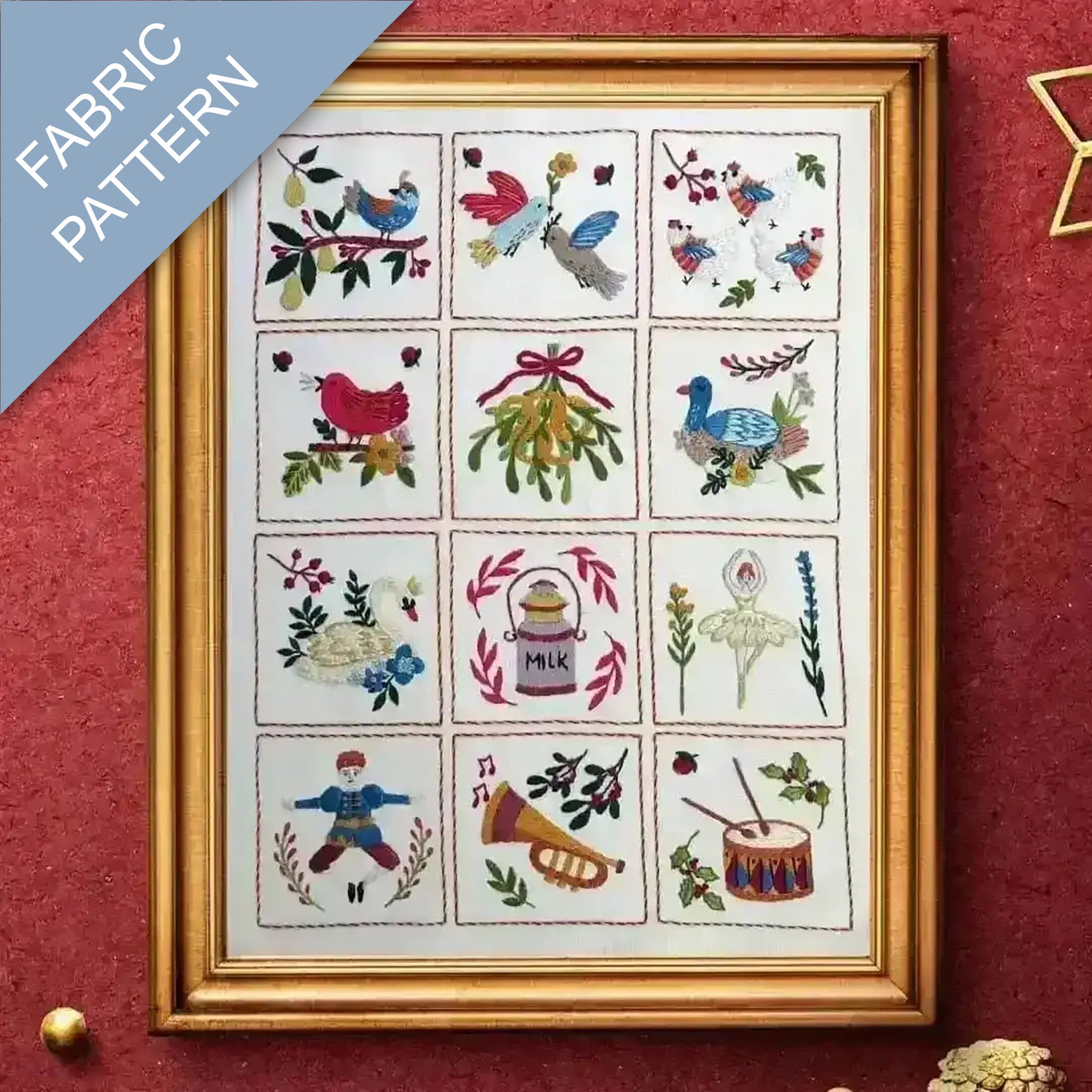Framed fabric pattern with embroidered designs on a red background
